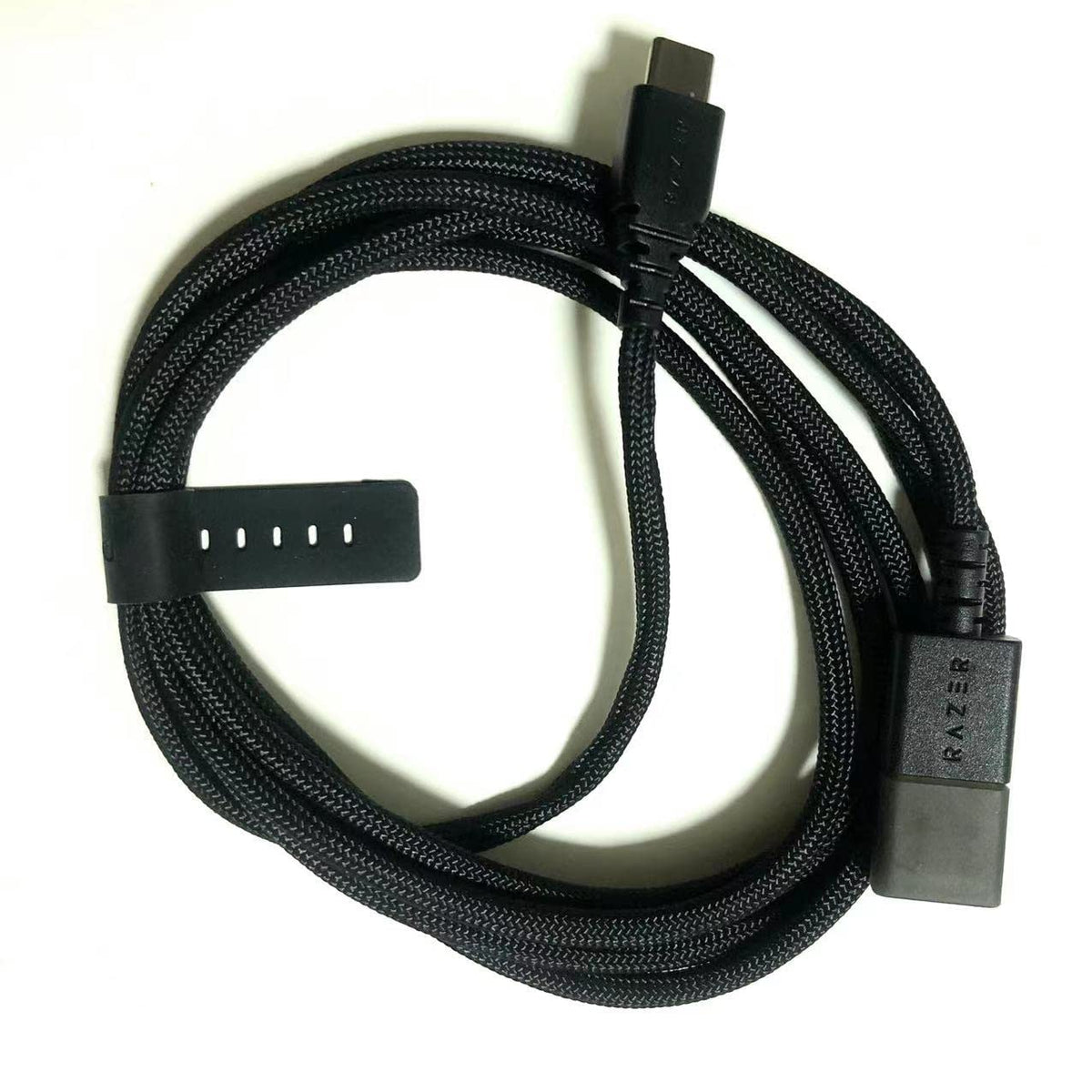 IRIDESCENT cable connected to Razer mouse in gaming setup for reliable charging benefit