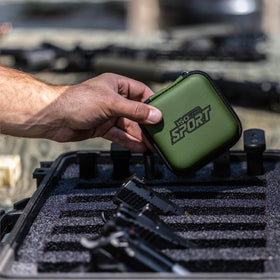ISOtunes Sport Advance BT earbuds in OD green for outdoor shooting.