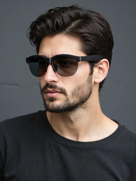 Hand holding ITHUGE sunglasses to show lightweight 35g scale