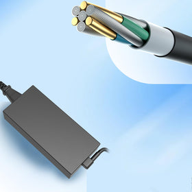 JAART adapter next to laptop to show size and portability benefit