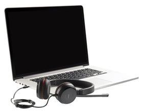Headset worn in a modern home office for comfortable all-day use.