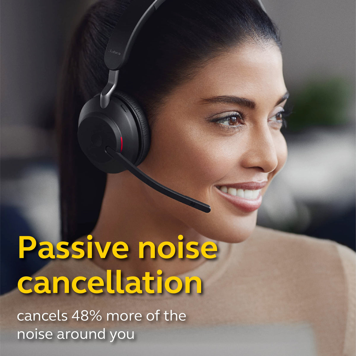 Jabra Evolve2 65 headset worn for all-day comfort during meetings.