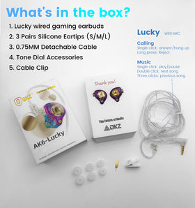 Jacuate packaging and accessories laid out including ear tips, cable, and earphones