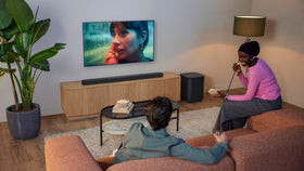 Detachable surround speakers attached to the JBL Bar 1300XMK2 showing wireless surround capability