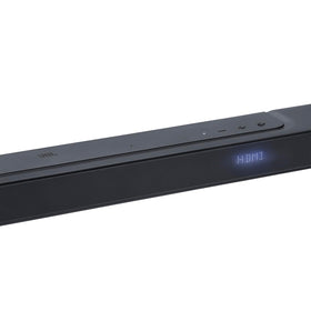 JBL Bar 300 front view in a cozy living room setup for enhanced TV audio.