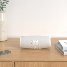 JBL Charge 5 side profile showing IP67 durable build for rain and sand