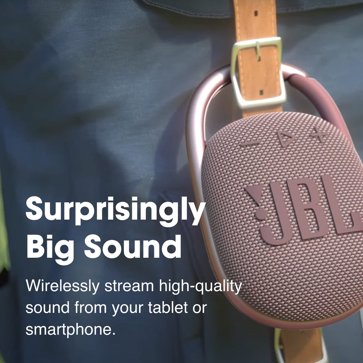 JBL Clip 4 Yellow carabiner attached to a bag for hands-free listening.