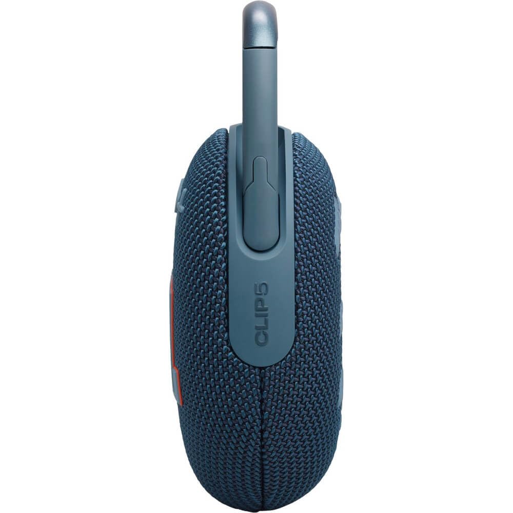 JBL Clip 5 poolside on towel demonstrating waterproof confidence in outdoor settings