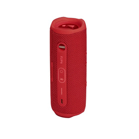 JBL Flip 6 in-use on the beach demonstrates vibrant color.