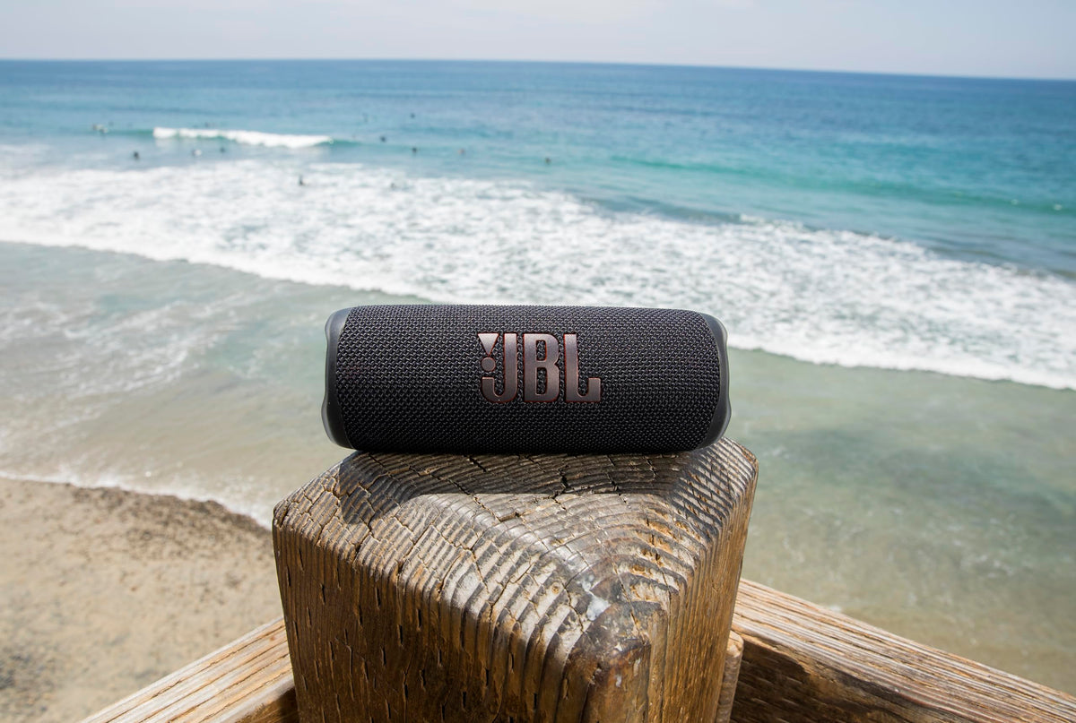JBL Flip 6 waterproof dustproof renewed exterior demonstrating IP67 durability near water
