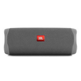 JBL Flip 5 front view in gray highlighting portable design for on-the-go listening.