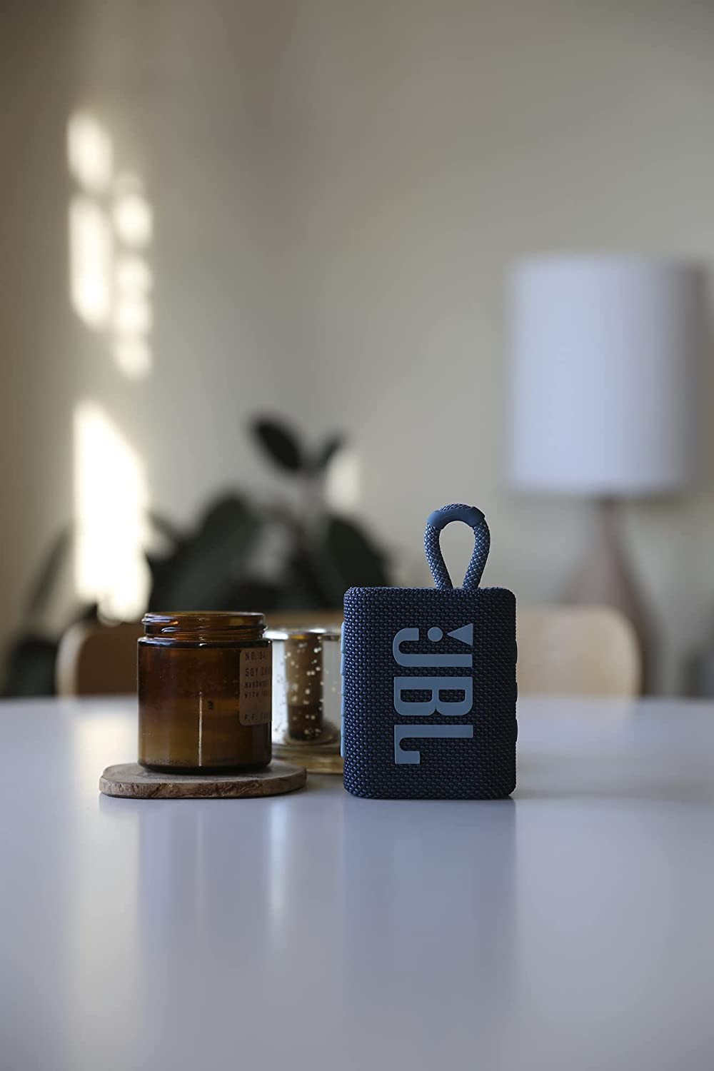 JBL Go 3 with included keychain LED clipped on for visibility and portable lighting