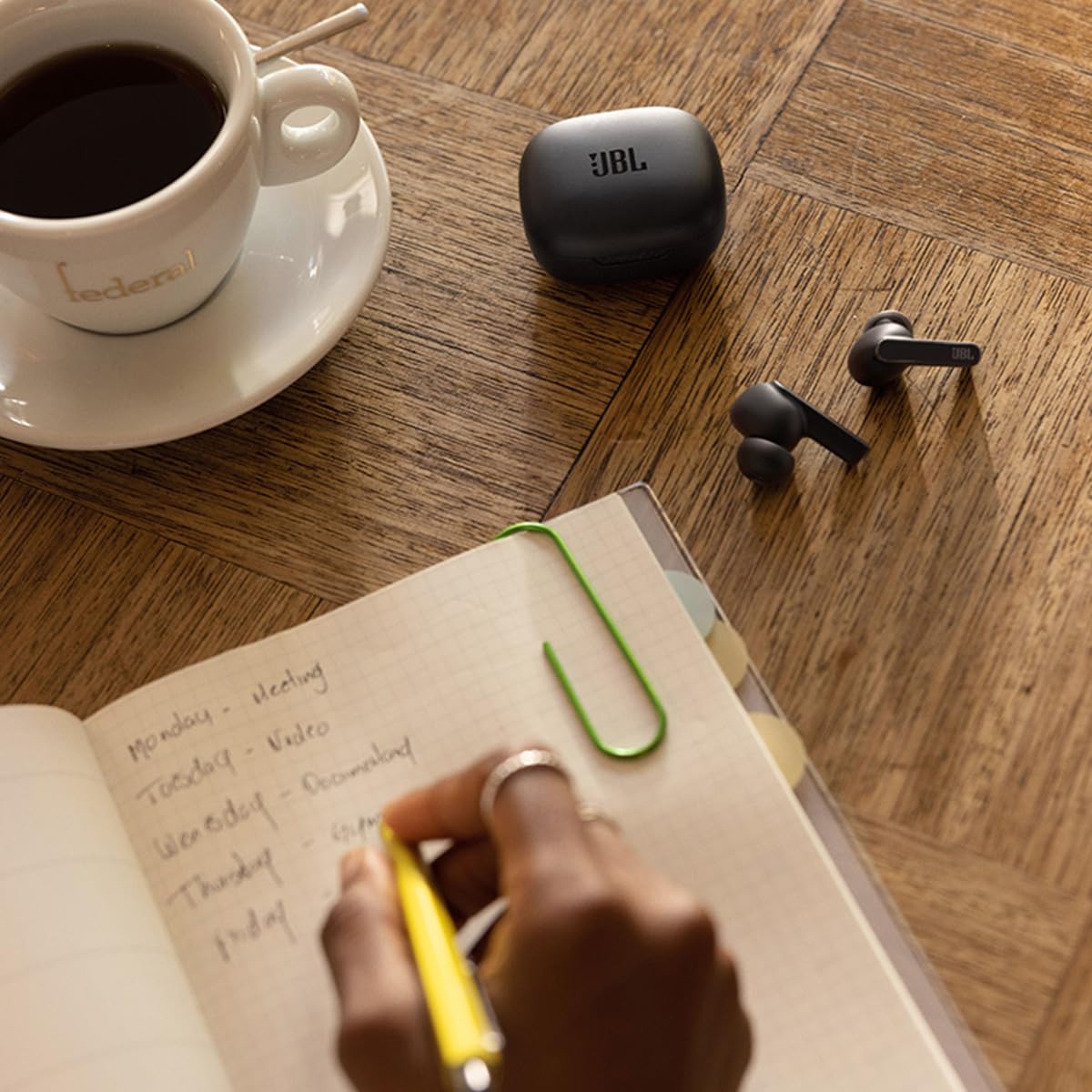 JBL Live Pro 2 charging case on a wireless charging pad