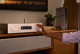 JBL MA310 living room setup fits modern white design aesthetics.