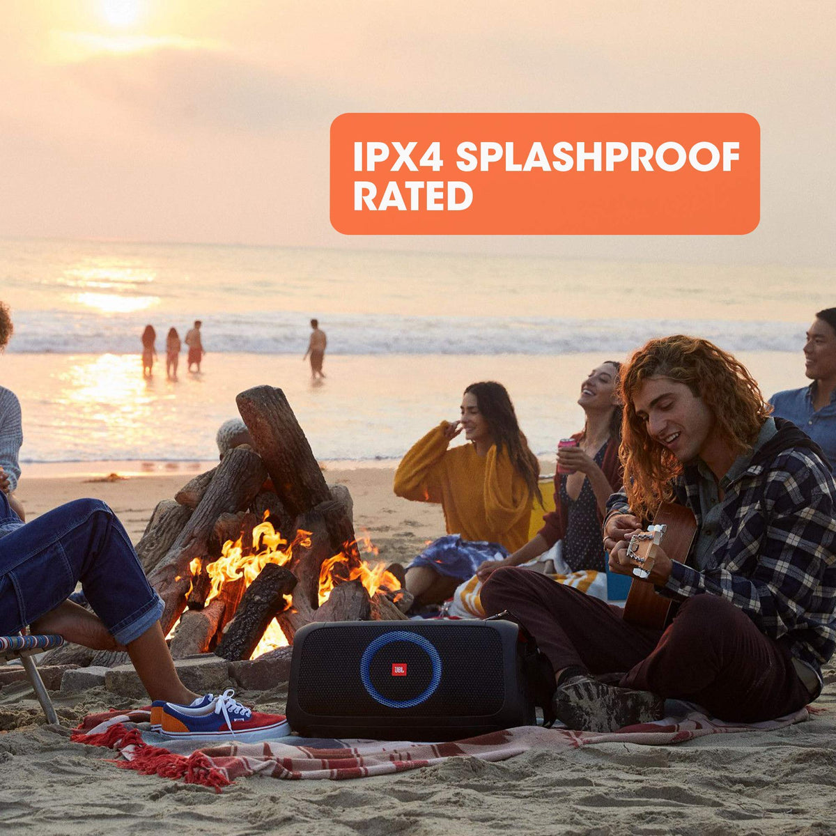 JBL PartyBox On-The-Go built-in bottle opener strap for convenience.