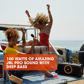 JBL PartyBox On-The-Go dynamic light display for outdoor parties.