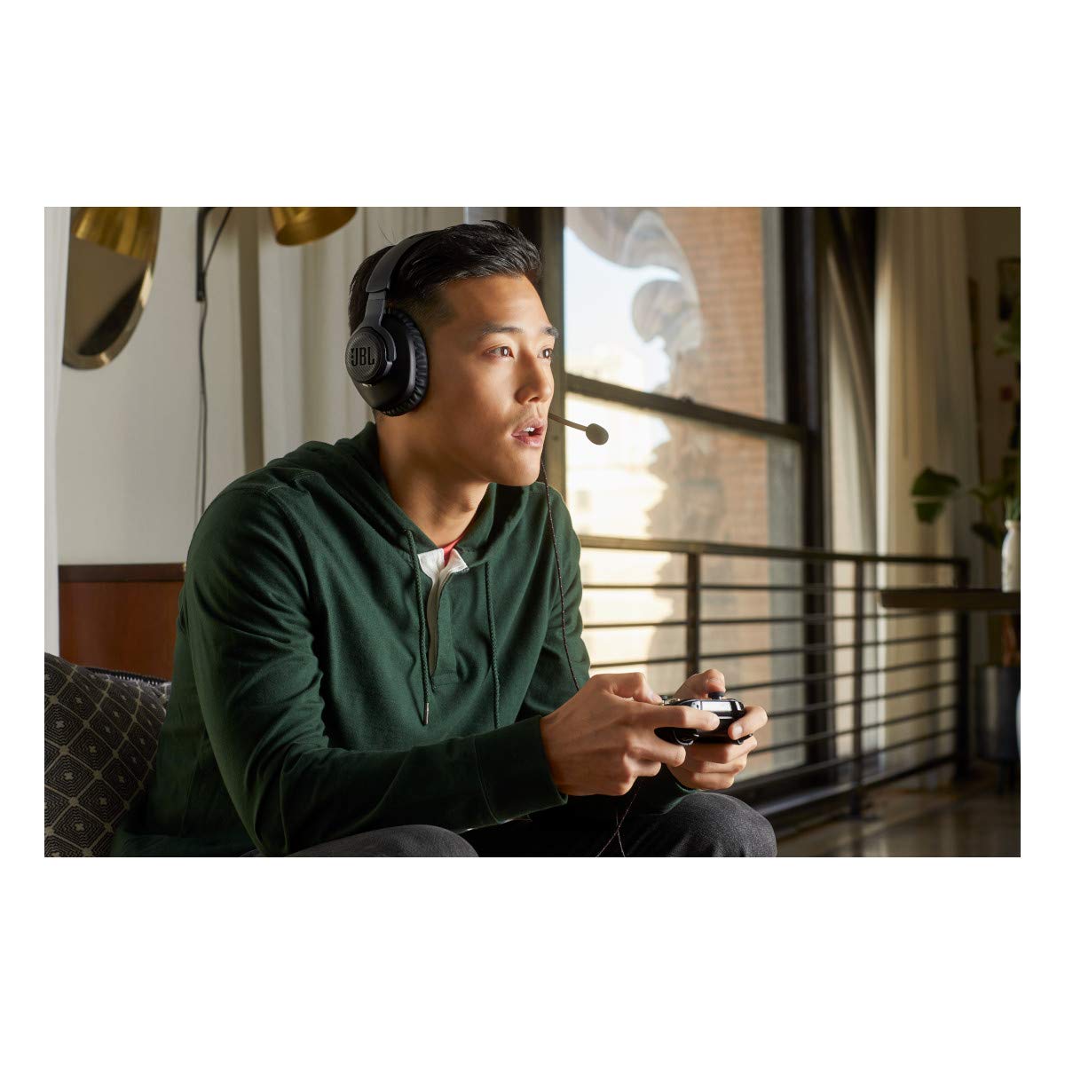 JBL Quantum 100 earcup close-up highlighting driver and seal benefit: enhanced directional cues
