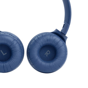 JBL Tune 510BT next to smartphone showing Bluetooth pairing convenience