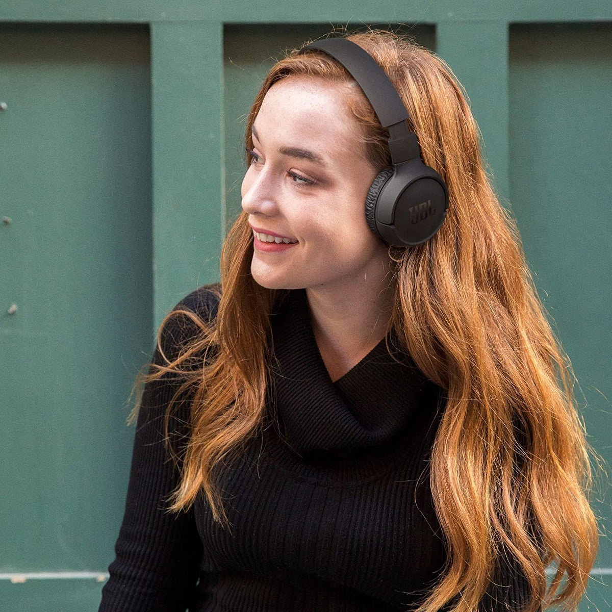JBL Tune 570BT worn during commute demonstrating comfortable on‑the‑go listening