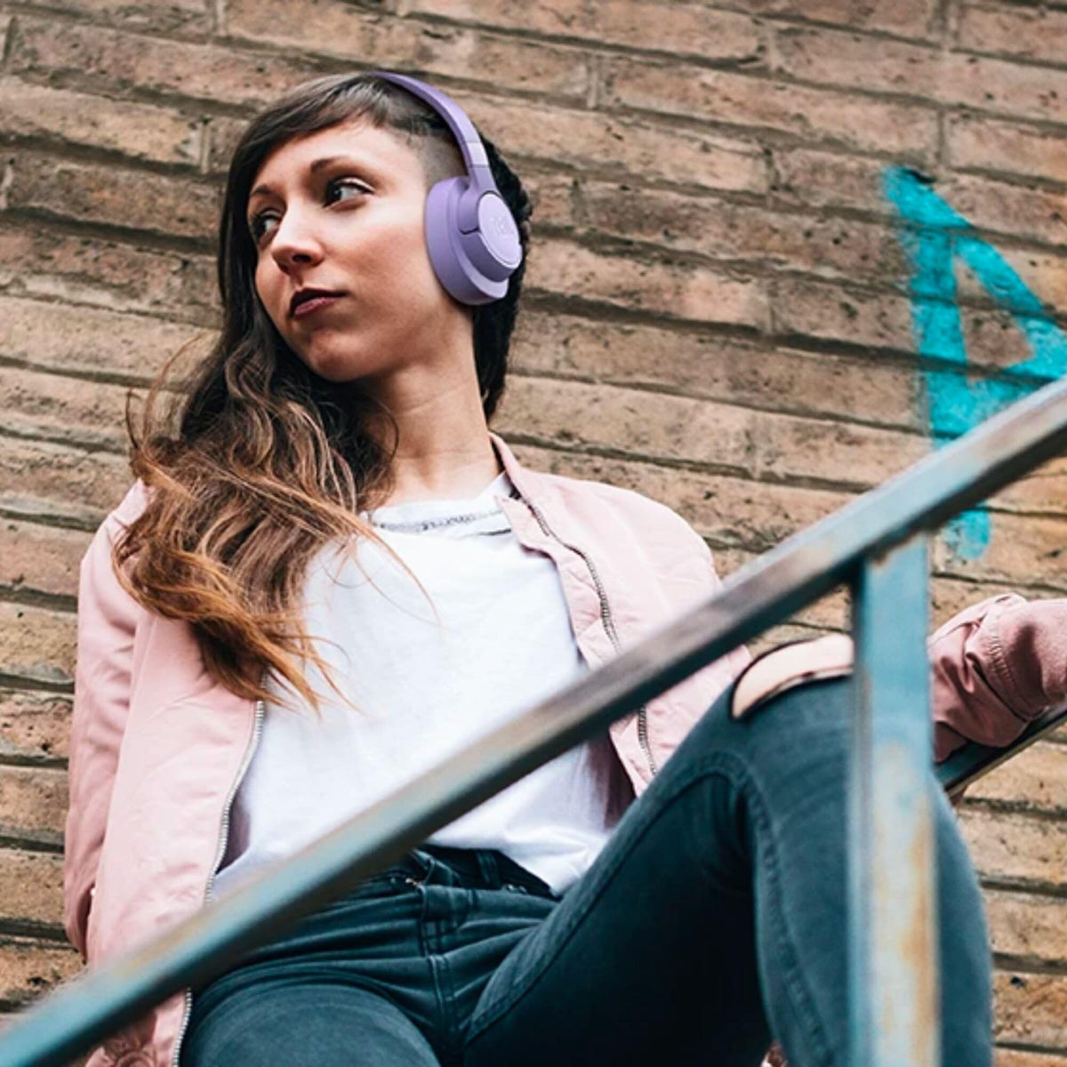 JBL Tune 720BT side view purple headphones showing foldable design for portability.