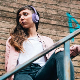 JBL Tune 720BT side view purple headphones showing foldable design for portability.