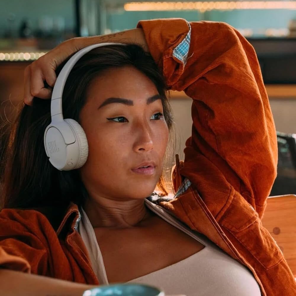 JBL Tune 520BT worn on commuter demonstrating hands-free convenience