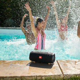 JBL Xtreme 2 shown at a poolside party setup