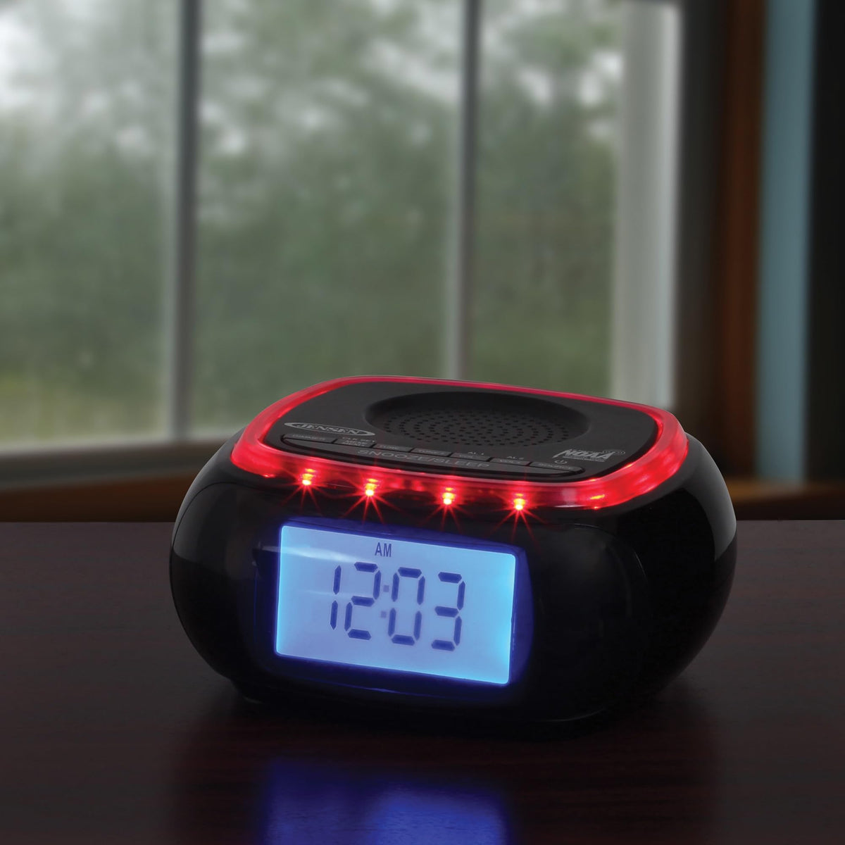 Jensen on bedside table announcing weather alerts and convenient alarm