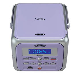 Jensen CD-660 top-loading CD tray detail for quick disc swaps and visible track info