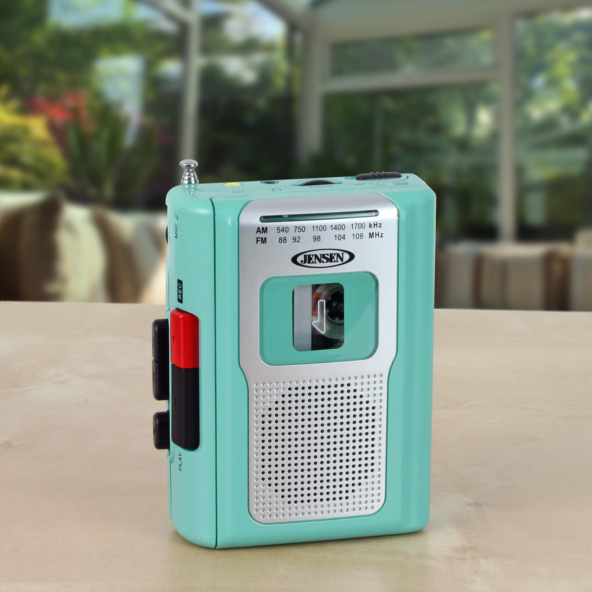 Jensen CR-100 Teal side view highlighting compact design for travel.