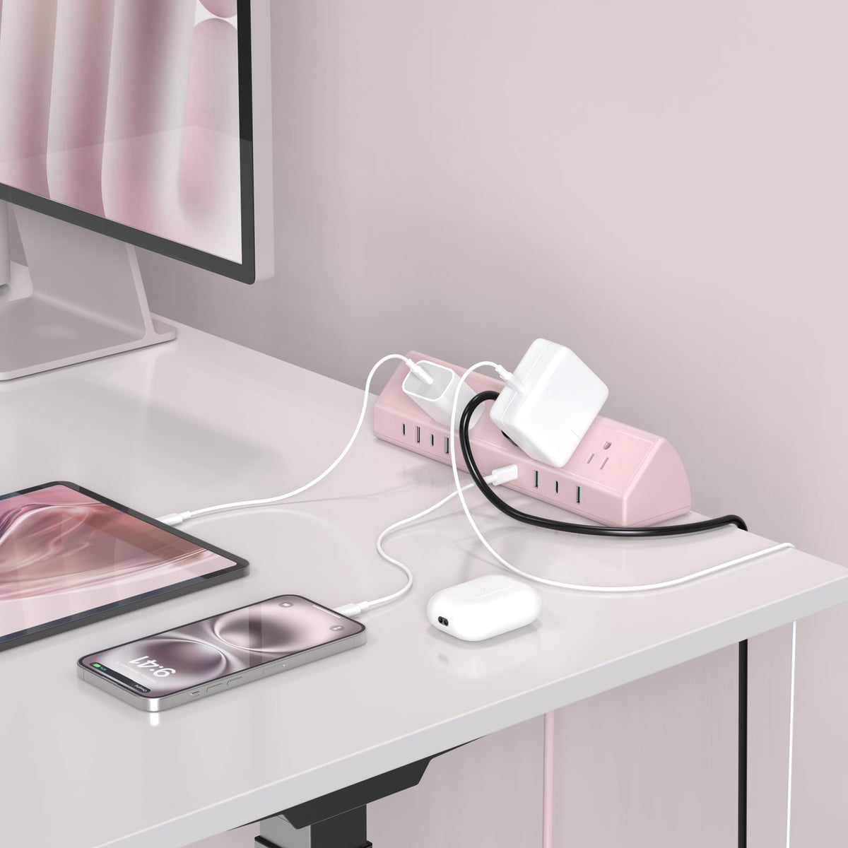 Jgstkcity on a home office desk charging laptop and phone for organized workspace