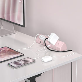Jgstkcity on a home office desk charging laptop and phone for organized workspace