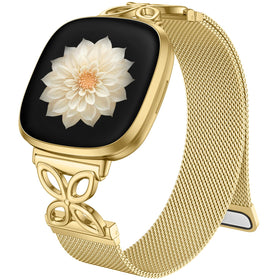 JKD floral metal band for Versa 4 with gold finish provides a secure, stylish fit.