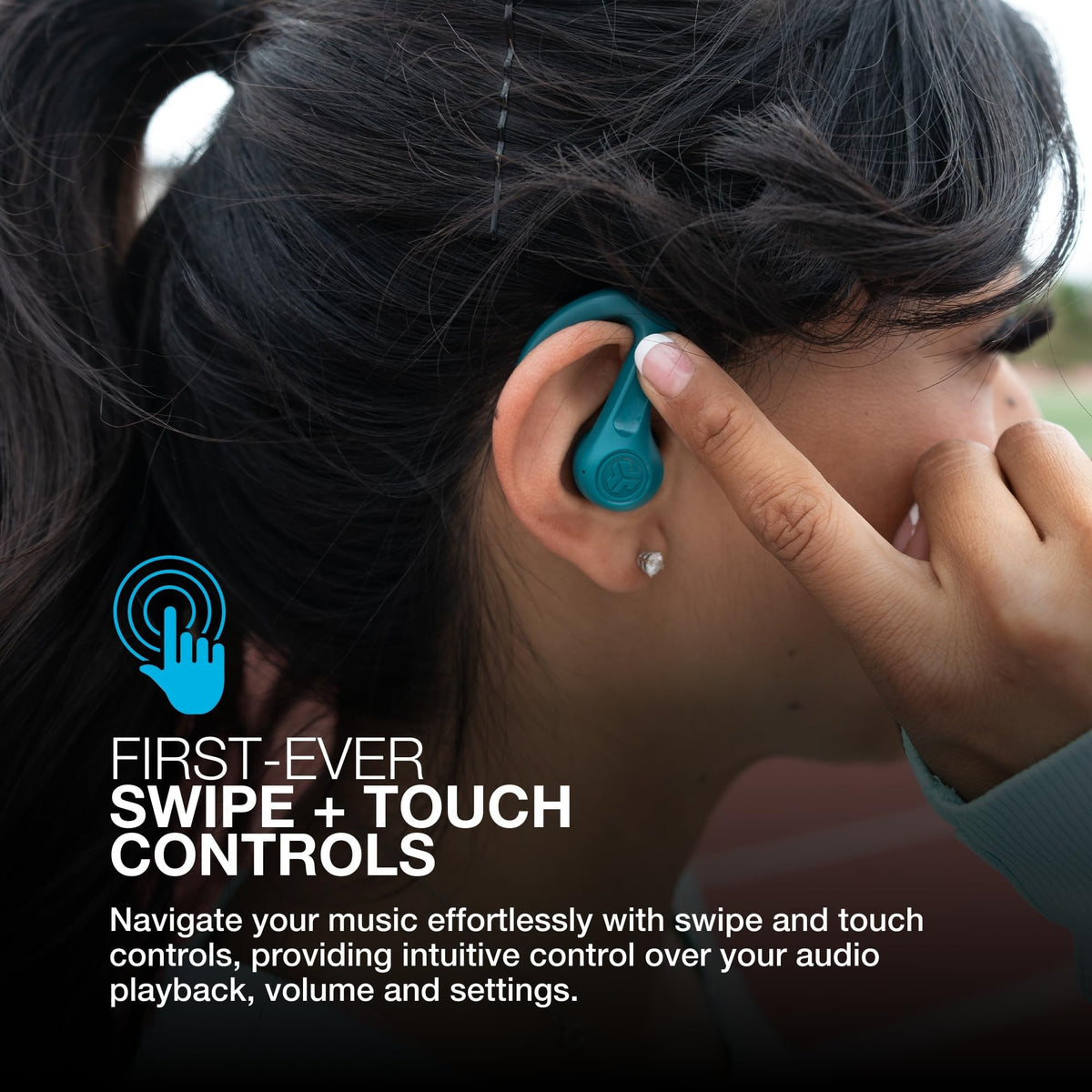JLab JBuds Sport ANC4 teal earbuds worn during a workout.