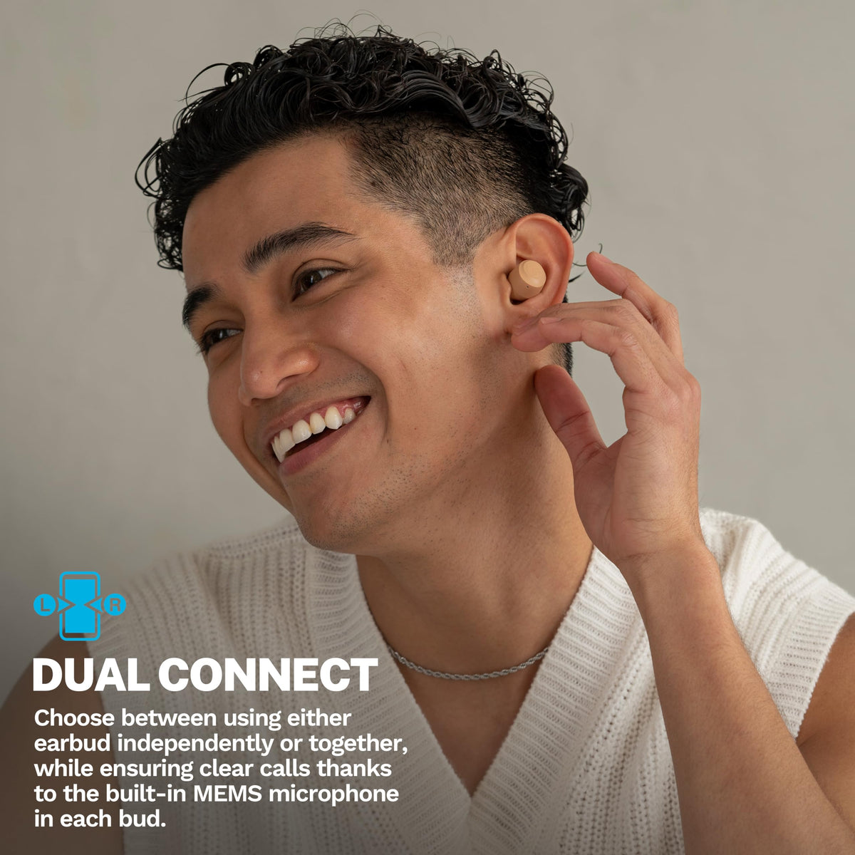 JLab earbud in ear during run displaying IPX4 sweat resistance and secure fit for workouts