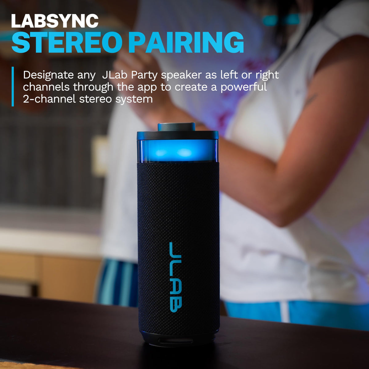 JLab Go Party beside a pool highlighting IP56 splash protection outdoors