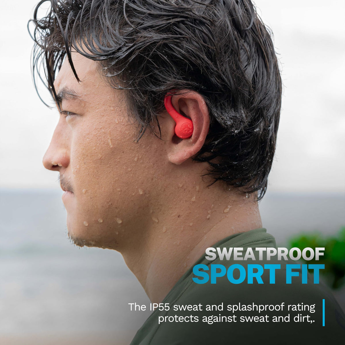 JLab Go Sport+ coral earbuds worn by runner showing stable fit