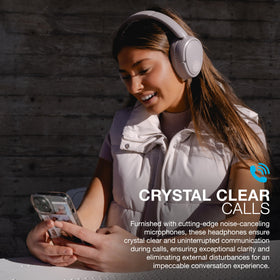 JLab JBuds Lux ANC next to smartphone showing size and Bluetooth multipoint benefit