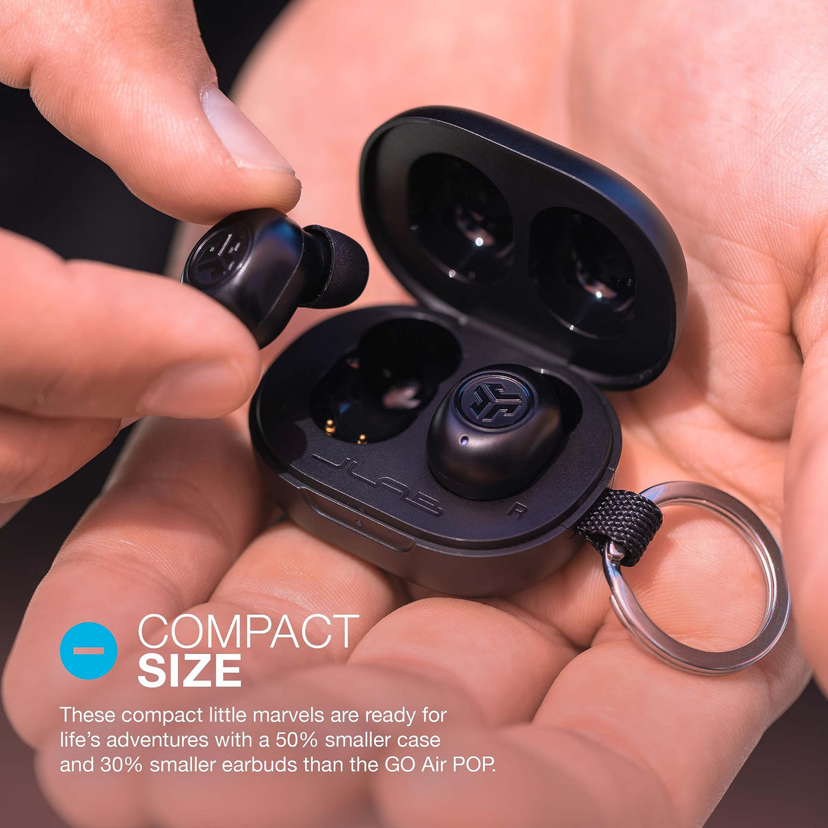 JLab JBuds Mini charging case open displaying earbuds and extended 20-hour battery backup