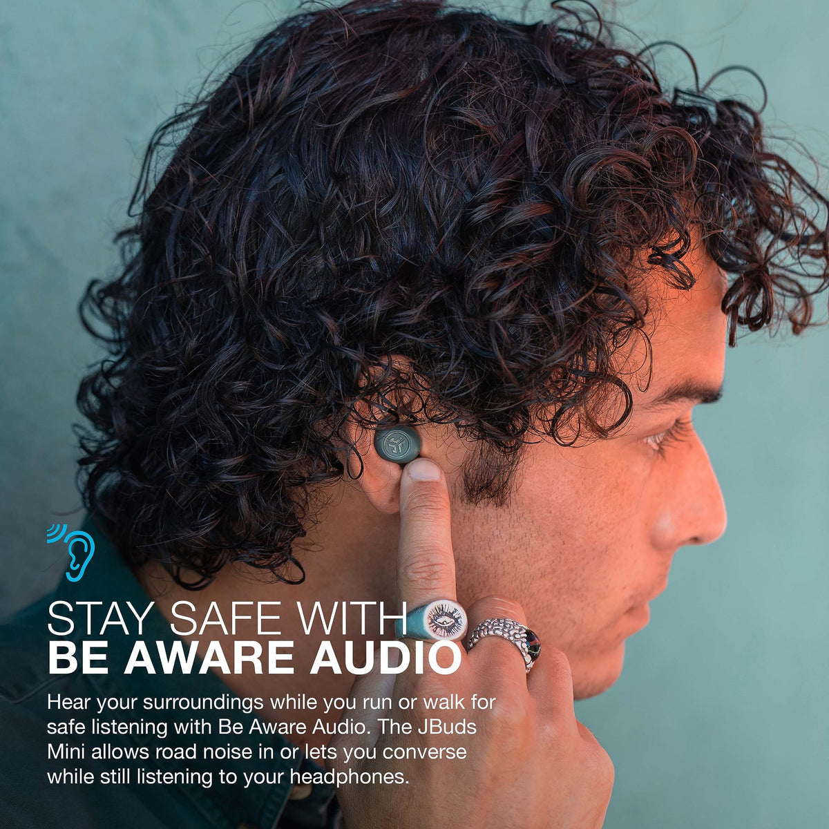 JLab JBuds Mini worn by runner showing sweat resistance and active use benefit