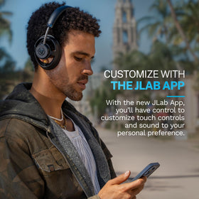 JLab JBuds Open paired with phone and laptop on screen showing multipoint convenience benefit