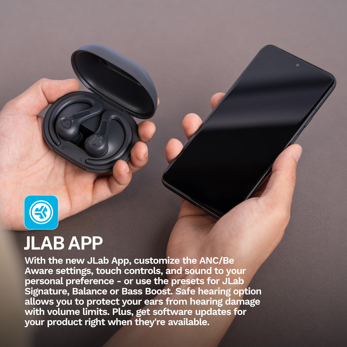 JLab JBuds Sport ANC 4 held in hand to show compact scale and travel convenience