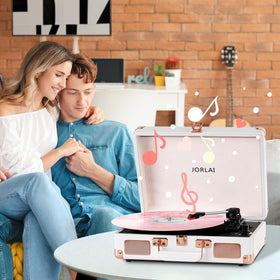 JORLAI turntable size comparison beside a vinyl and book showing compact footprint