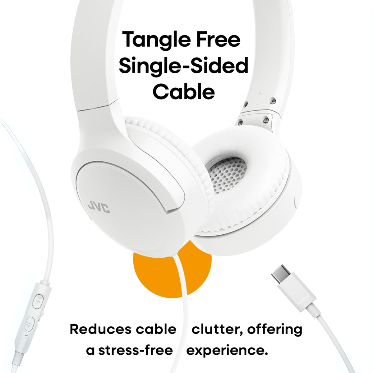 JVC headphones next to laptop to show scale and workspace compatibility