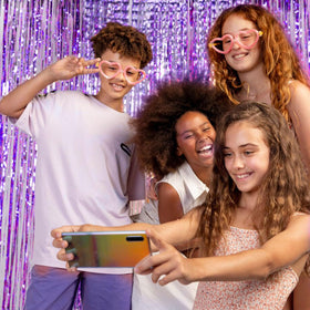 K.E.J baby shower backdrop in purple glitter improves photos and ambiance