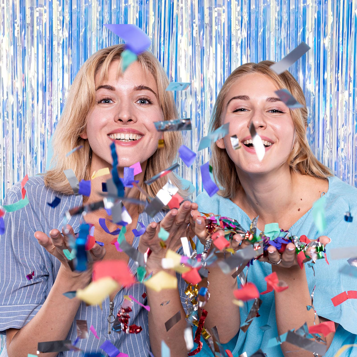 K.E.J. foil curtain used as photo booth backdrop improving party photos