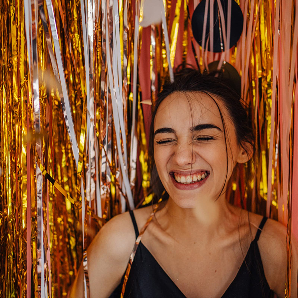 K.E.J. foil fringe hung as a photo booth backdrop demonstrating instant party glamour