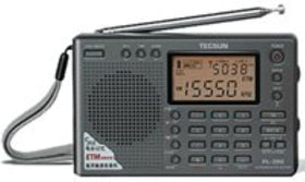 Kaito TECSUN PL-380 on a camp table illustrating travel-ready reception and convenience benefit