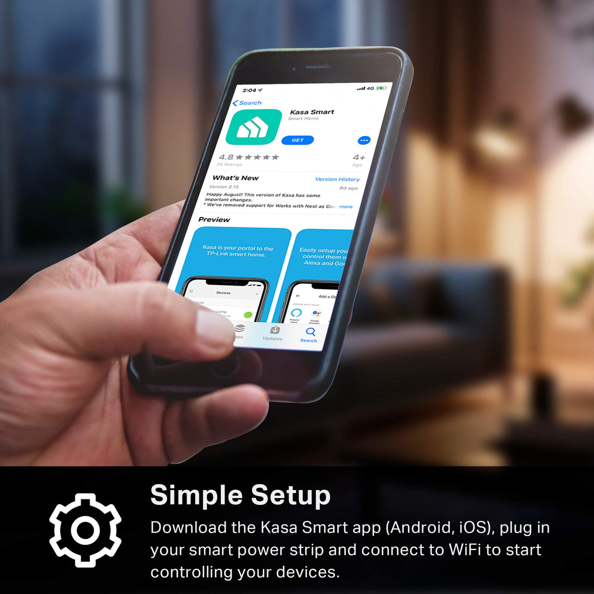 Kasa Smart KP303 beside a smartphone for scale showing compact footprint