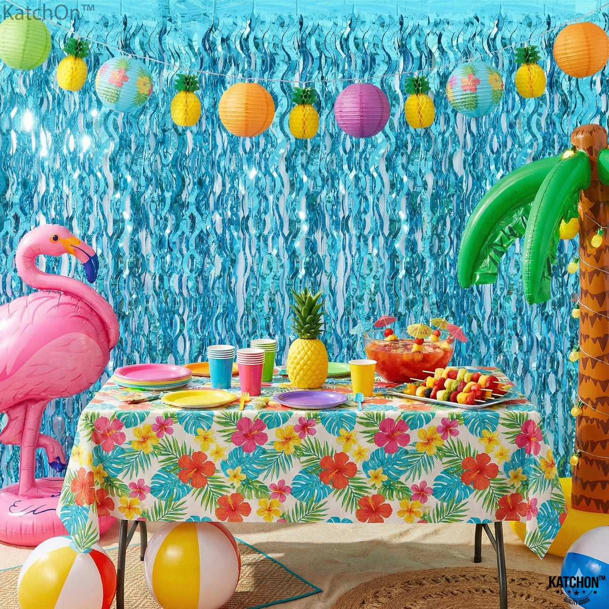 KatchOn sparkle blue foil curtain elevates beach party décor with reflective depth.